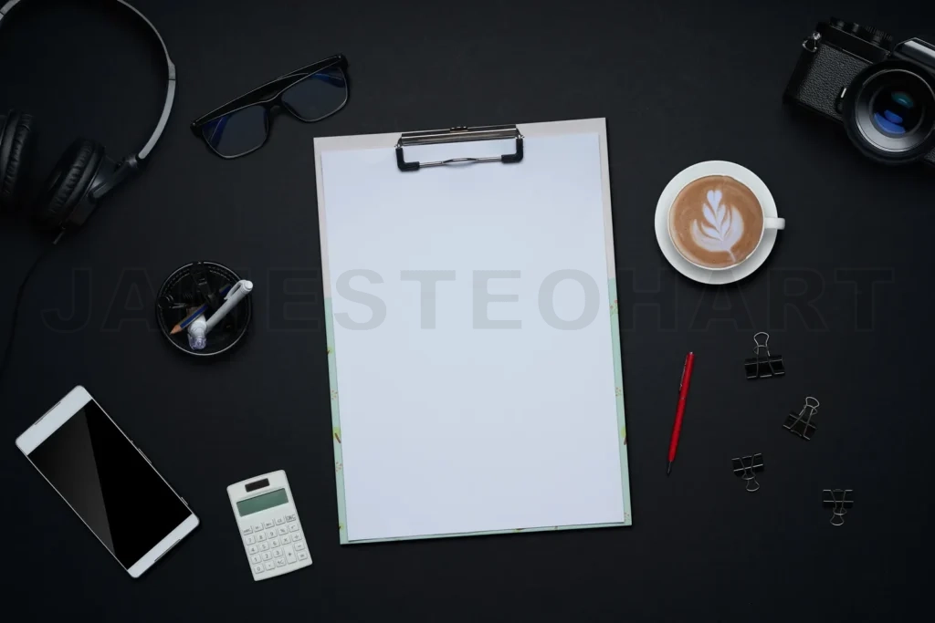 
Productive creative workspace with blank clipboard and coffee
