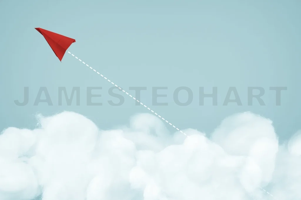 
Red paper plane flying high above clouds reaching goals