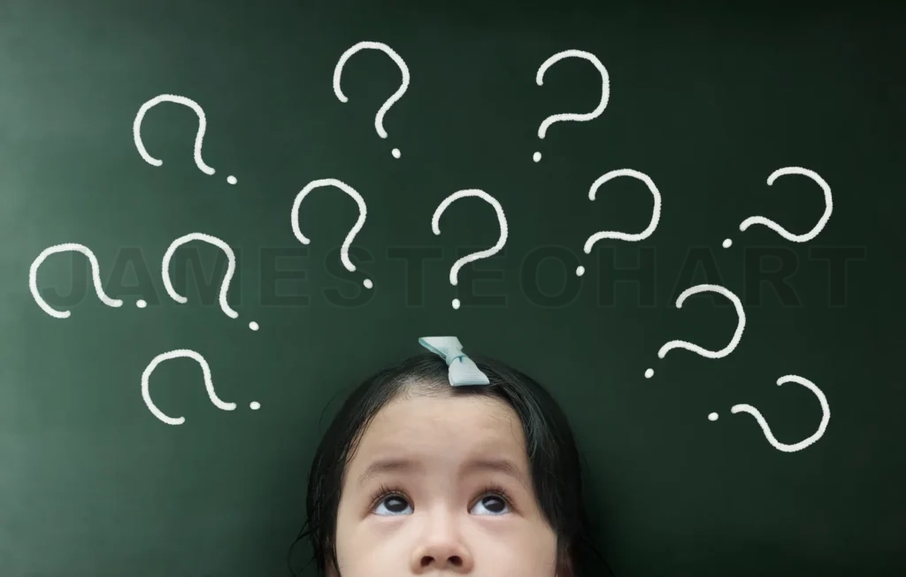 
Little Girl Thinking With  Question Mark Over Her Head