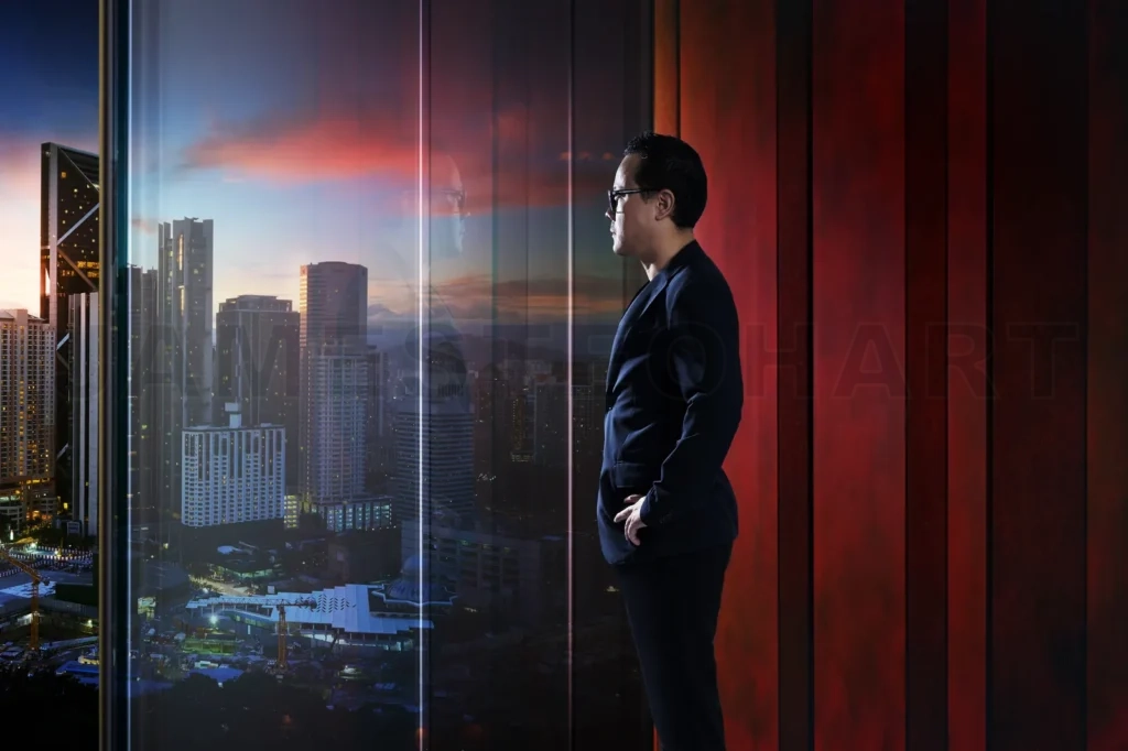 
Young Businessman Looking Out The City In The Office