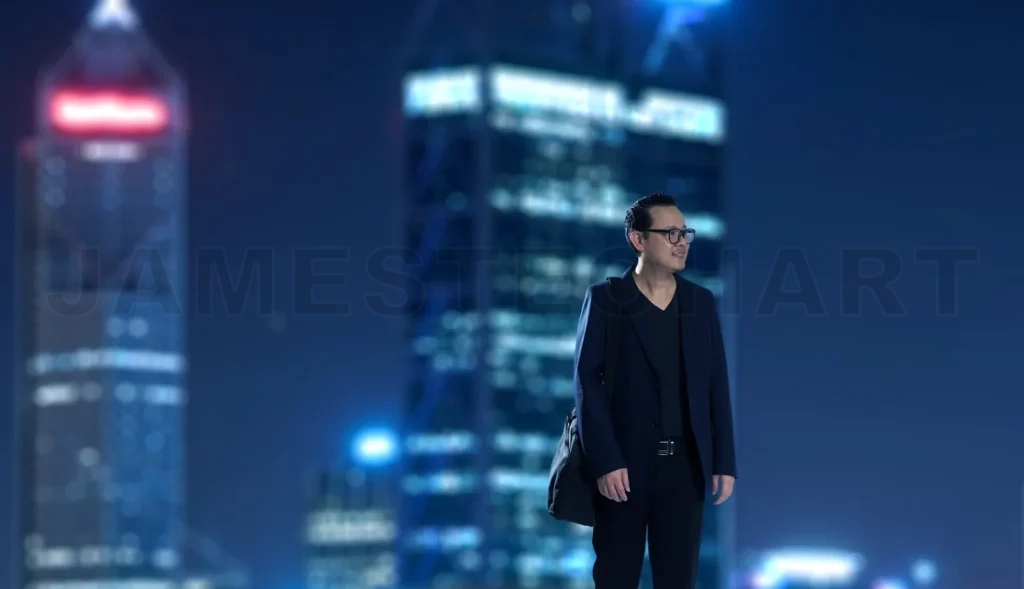 
Young Businessman Standing With Out Of Focus City Skyscraper Background