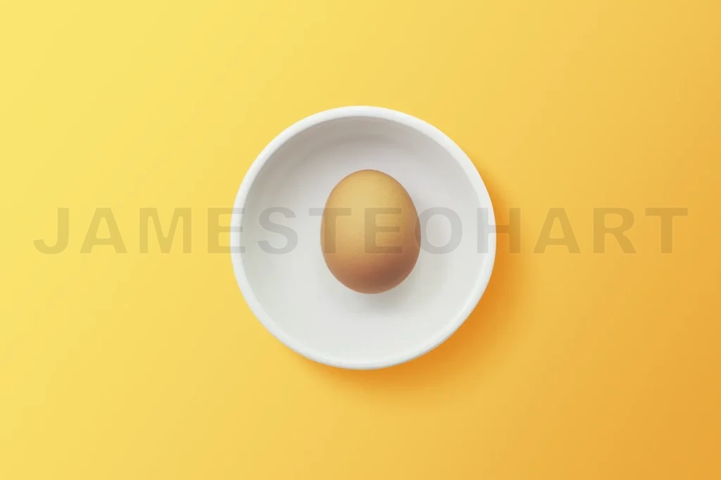 
Top View Of Egg In Bowl ,Orange Background