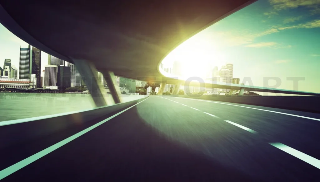 
Highway And Bridge Overpass Motion Blur With City Skyline Background