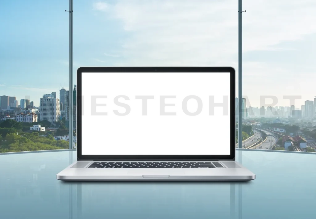 
Laptop With Blank Screen On Table