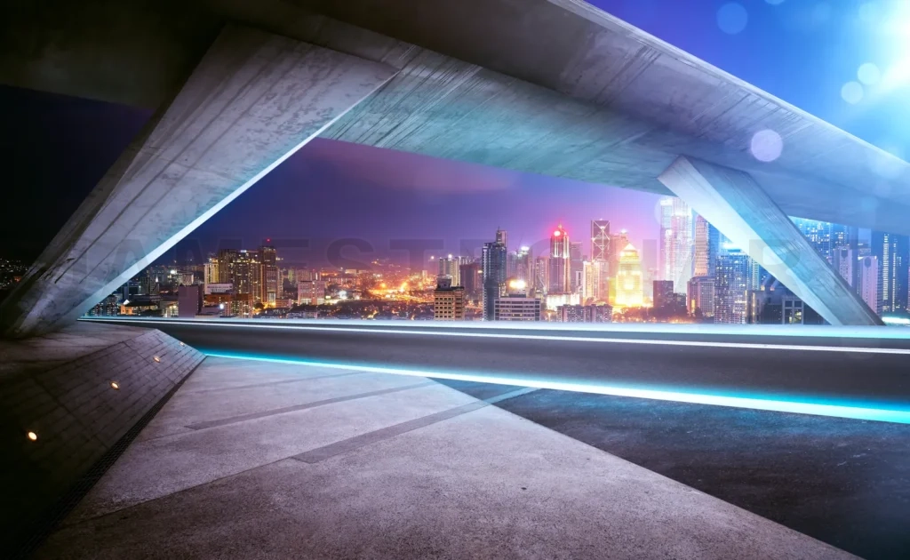 
Empty Asphalt Road Under The Bridge During The Night With Beautiful City Skyline Background